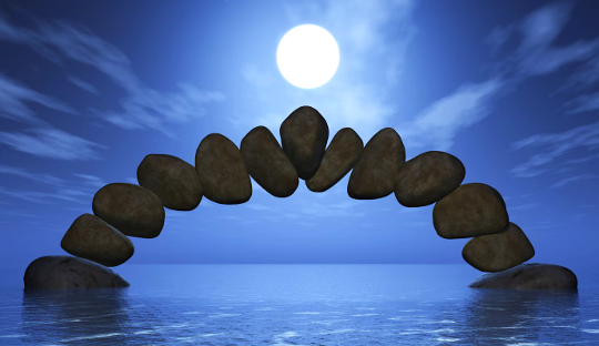 full moon over the water and an arch of stones